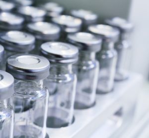 Glass vials for drug containment lined up in rows