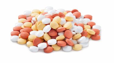 Pile of orange and white pills