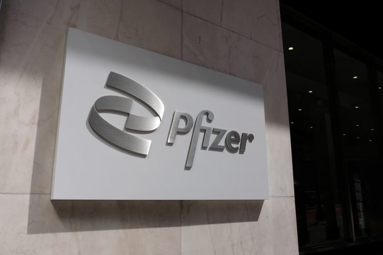 Pfizer logo on a sign in New York city, US [Credit: Molly Woodward / Shutterstock.com]