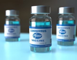 Vials labelled 'COVID-19 Vaccine Pfizer' [Giovanni Cancemi / Shutterstock.com].