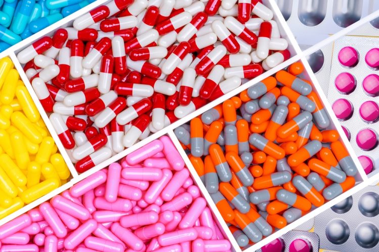 Different colors and types of pharmaceuticals (pills, tablets and capsules)