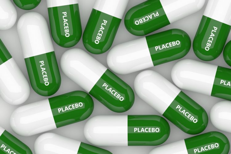 3D illustration of green and white capsules, each labelled placebo