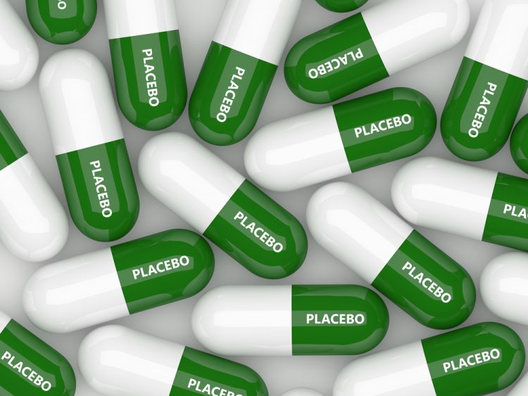 3D illustration of green and white capsules, each labelled placebo