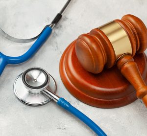 Medical/Pharmaceutical regulation concept - gavel and stethoscope