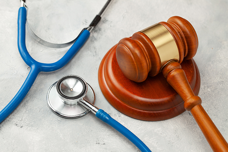 Medical/Pharmaceutical regulation concept - gavel and stethoscope