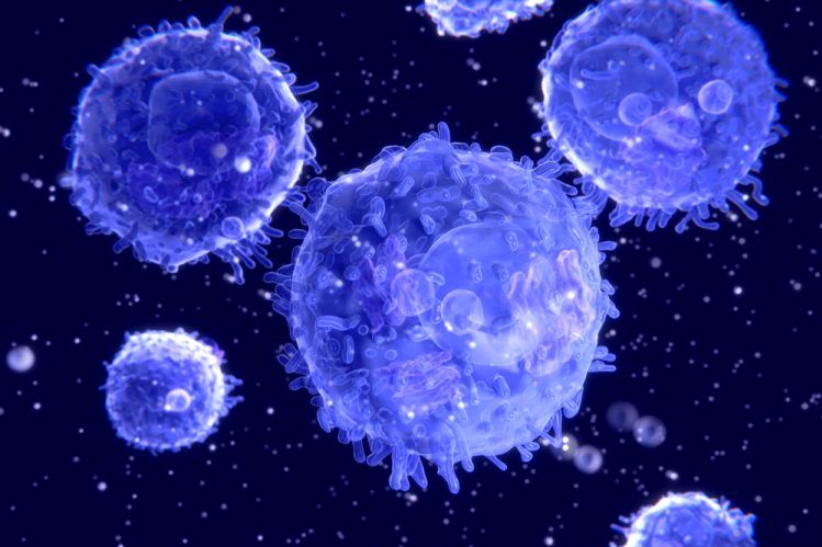 3D illustration of T cells (lymphocytes) in light blue on a dark blue background - idea of cell therapy