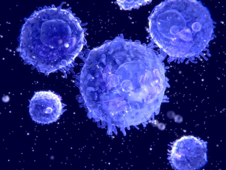 3D illustration of T cells (lymphocytes) in light blue on a dark blue background - idea of cell therapy