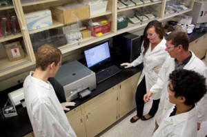 Left to right: William Denk, Anya Todic, John Brennan and Kevin Yin using the Infinite M200 PRO microplate reader
