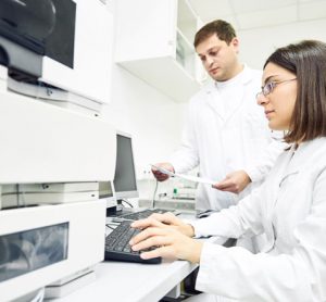 Scientists in lab performing two dimensional liquid chromatography