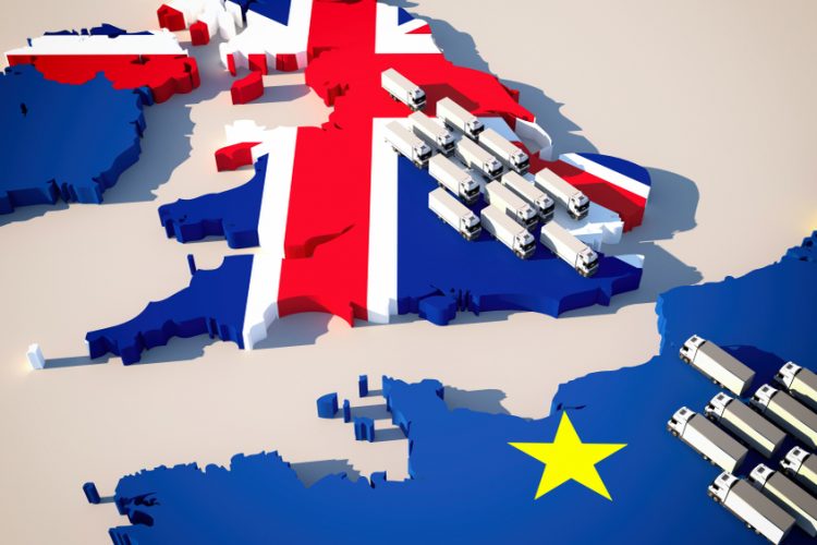 Map with UK in Union Jack colours and Europe in EU flag design with lorries on either site of the British channel - idea of trade between UK and EU/trade deal