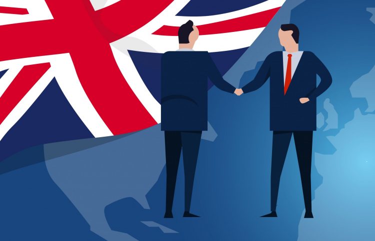 artoon of business people shaking hands in frnt of Union Jack flag