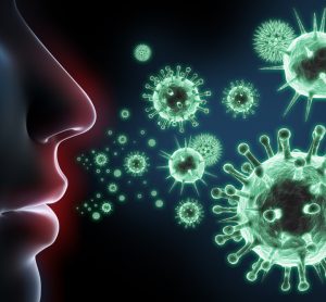 various viruses in green in front of human face