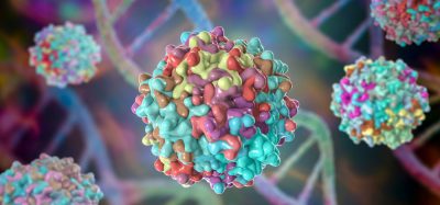 3D illustration of brightly coloured adeno associated viruses in front of DNA strands - idea of viral vectors for gene therapy