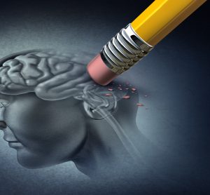 Alzheimer's disease concept - rubber on the end of a pencil erasing the back of a drawing of the human skull and brain - idea of neurodegeneration
