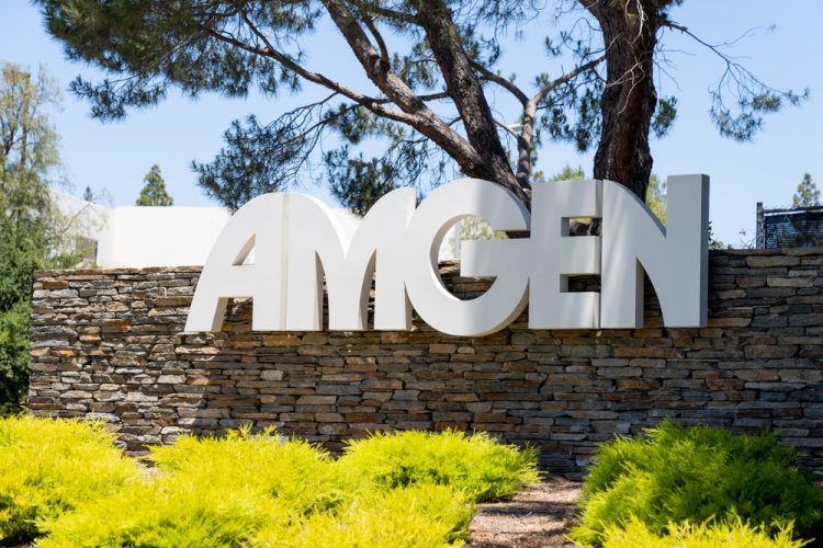 Close up of Amgen sign at its headquarters in Thousand Oaks, California, USA [Credit: JHVEPhoto/Shutterstock.com].
