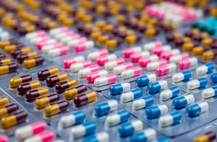 Selective focus on colorful antibiotic capsules in blister pack.