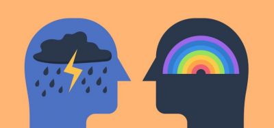 Cartoon of two human head silhouettes facing, one with a rainbow in the section where the brain would be, the other with a raincloud - idea of bipolar disorder (one side bipolar depression, the other side mania)