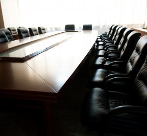 meeting room table with chairs around it