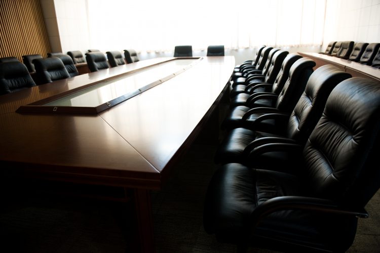 meeting room table with chairs around it