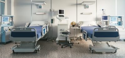 two empty hospital beds on a ward - idea of clinical research/trials