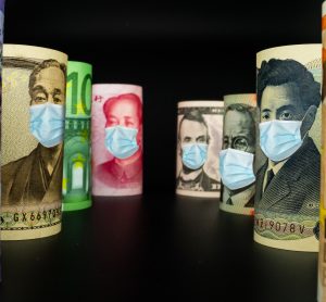 various currency notes with facemasks on the pictures of the leaders