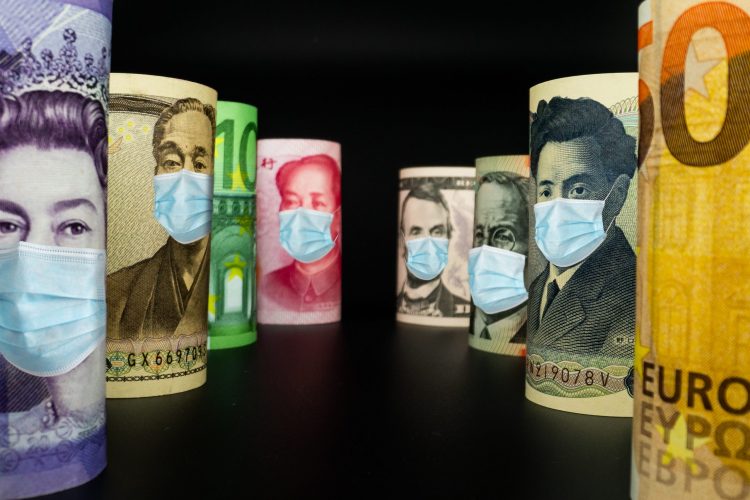 various currency notes with facemasks on the pictures of the leaders