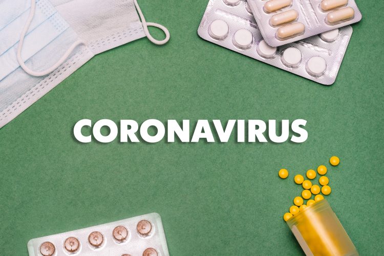 the word 'coronavirus' surrounded by tablets and a face mask