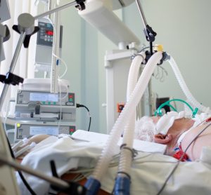 older, male COVID-19 patient on a ventilator