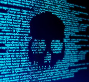 computer code in glowing blue with a black skull shape in the middle - idea of a cyber attack