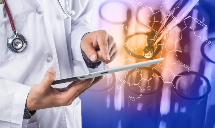 laboratory scientist in white coat holding a tablet with laboratory experiment running in background