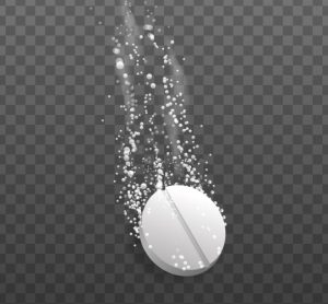 Illustration of a white pill disintegrating with a trail of particles behind it on a grey background