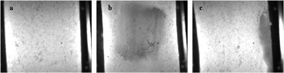 Figure 3 Extrusion. Visual images, captured by a CCD camera, of a normal rod (a) and a rod with a marble spot, located parallel (b) and perpendicular (c) to the detector