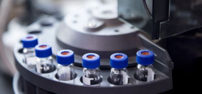 blue capped vials are arranged in the auto-sampler of gas chromatography equipment
