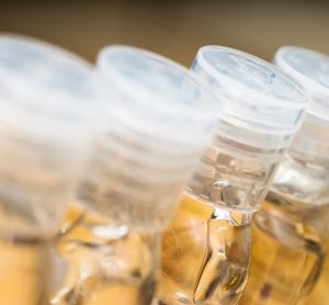 line up of clear hand sanitiser bottles