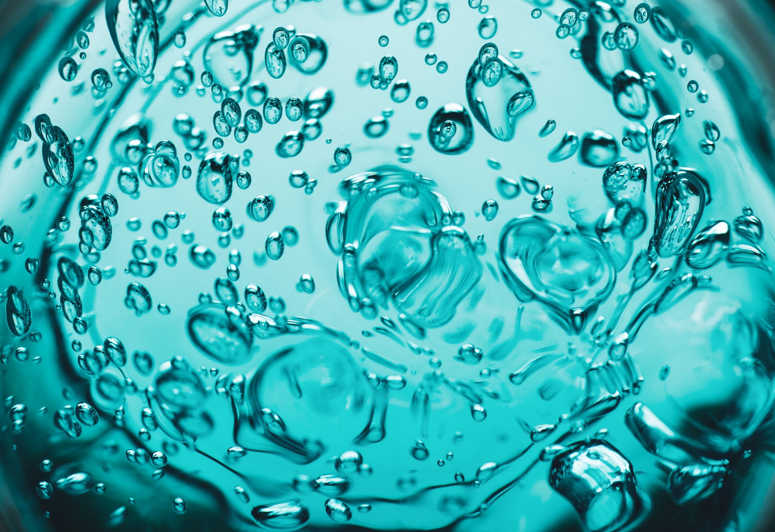 teal coloured hydrogel with bubbles in it