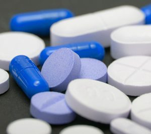 pile of blue and white pills