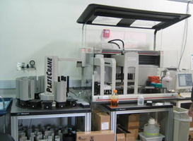 Figure 1: Biomek FX™ (Beckman Instruments) configured with one 384-well pipetting head, one Span-8 pipettor integrated to a PlateCrane robotic arm (Hudson Control). This instrument is capable of performing complex plate to plate transfer as well as flexible reagent addition protocols in a walk away operation mode.