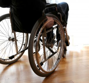 disabled person, potentially suffering with ALS, in a wheelchair