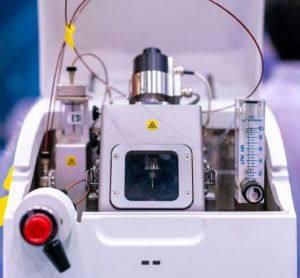 close up of a mass spectrometer device with blurred lab background - idea of mass spectrometry