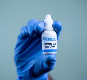 nasal vaccination concept - nasal spray labelled intranasal COVID-19 Vaccine