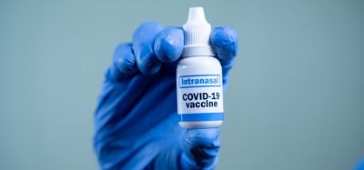 nasal vaccination concept - nasal spray labelled intranasal COVID-19 Vaccine