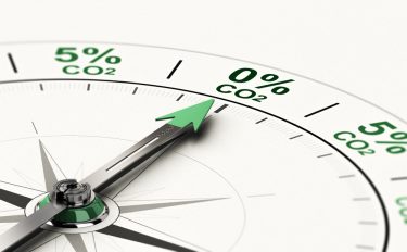 3D illustration of conceptual compass with needle pointing 0 percent of CO2. Concept of net zero carbon emissions