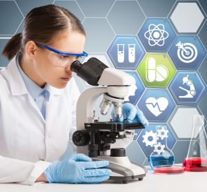 woman looking down a microscope with a graphic indicative of medical/pharmaceutical research behind