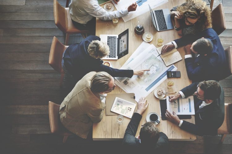 business people collaborating on a project at a table