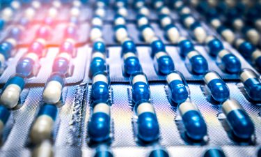 Blue and white capsule pills in blister pack.