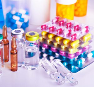 drug products of various forms in various types of packaging, including liquid in glass vials and pills/capsules in blister packages - idea of medicines or pharmaceuticals