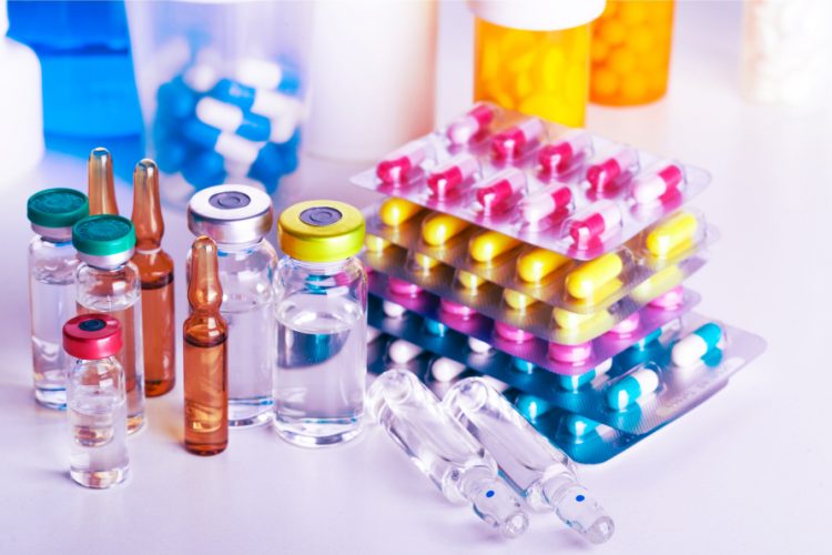 drug products of various forms in various types of packaging, including liquid in glass vials and pills/capsules in blister packages - idea of medicines or pharmaceuticals