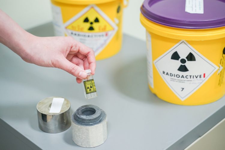 hand holding a vial of Iodine 131(I-131)- a Radioactive isotope used for hyperthyroidism treatment