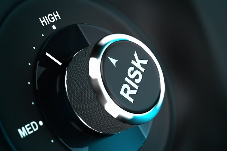 Twisting knob with the word 'risk' on it pointing between medium and high level