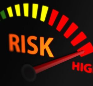 Graphic of a risk indicator with an arrow pointing to red - idea of high risk